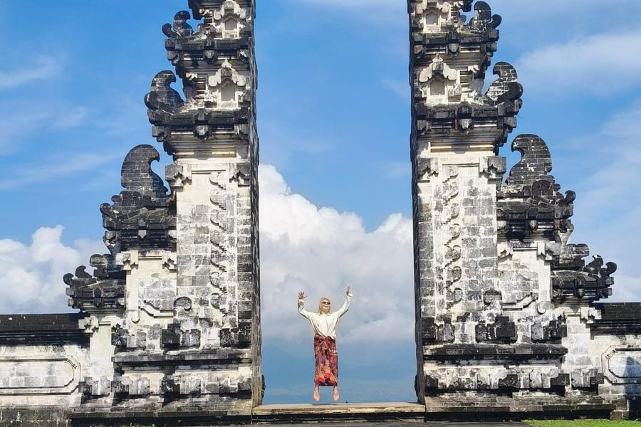 Visitor standing between the Gates of Heaven at Pura Lempuyang, Bali