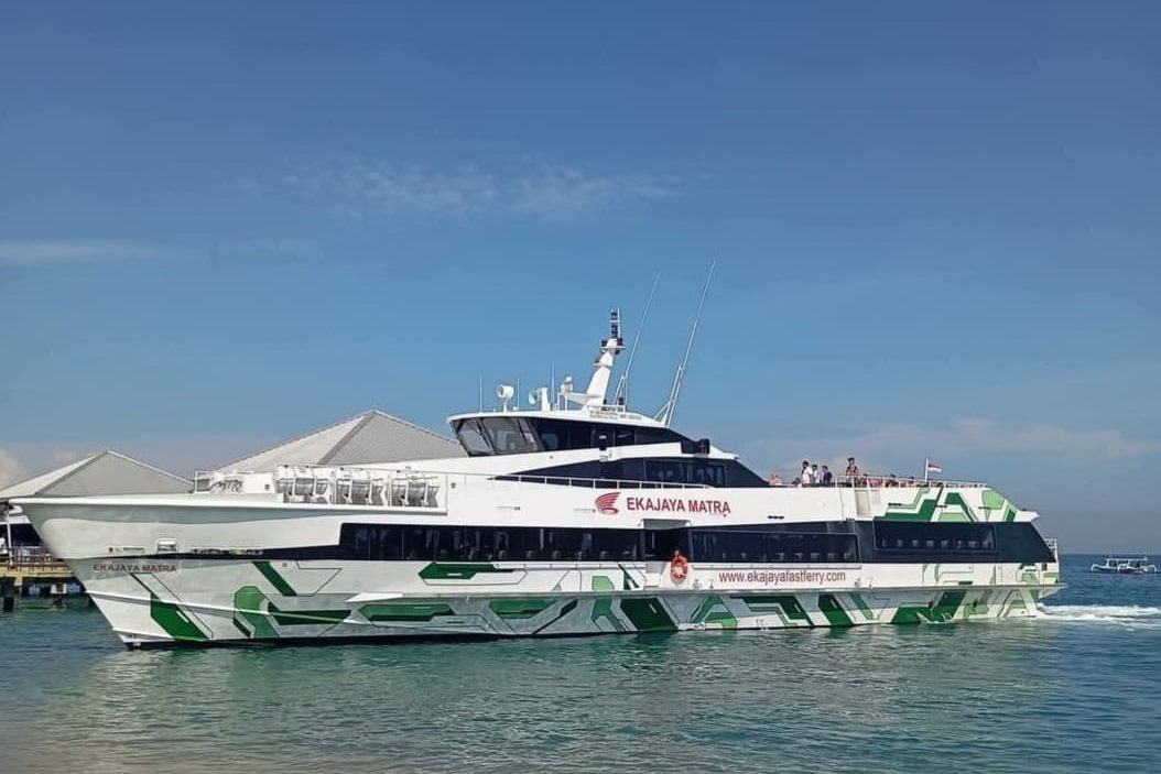 Ekajaya Matra fast ferry moored just off the beach