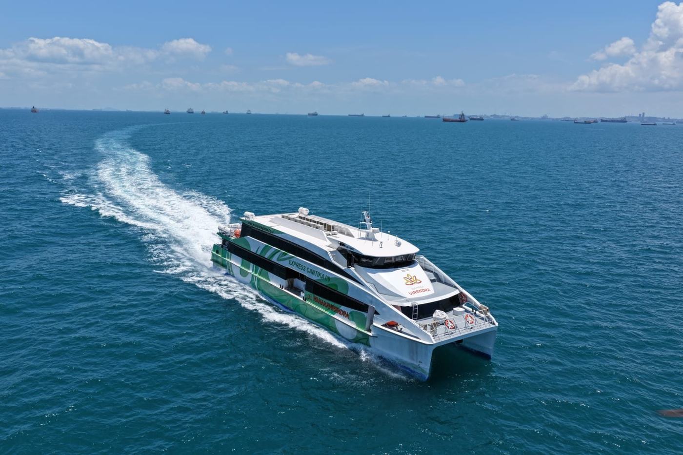 Fast ferry at cruising speed with its wake behind it