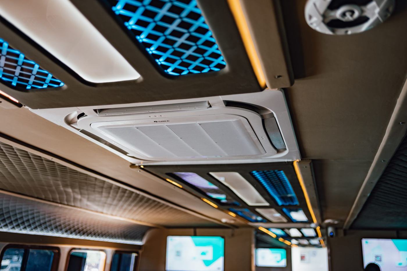 Overhead air conditioning vents running the length of the cabin