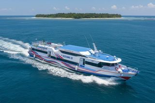 Wijaya Tramena fast ferry passing a small island
