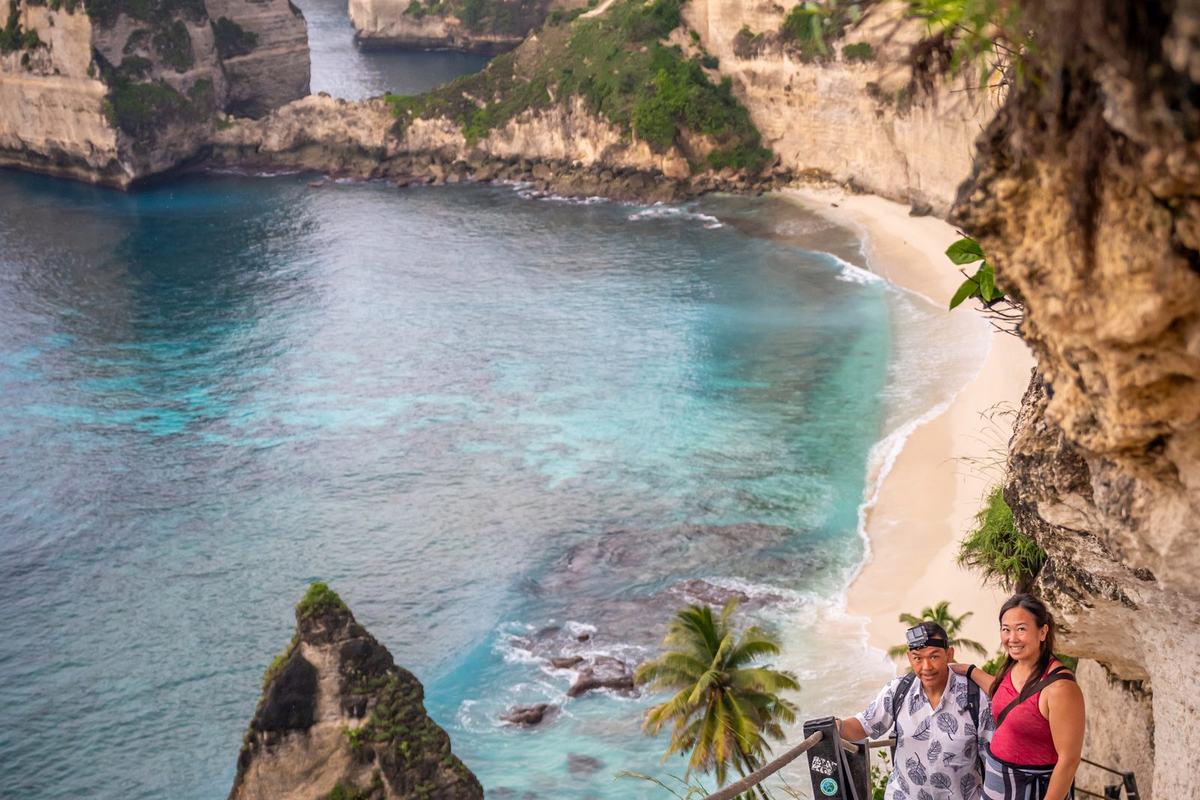 Cliff pathway down to a hidden turquoise bay on Nusa Penida