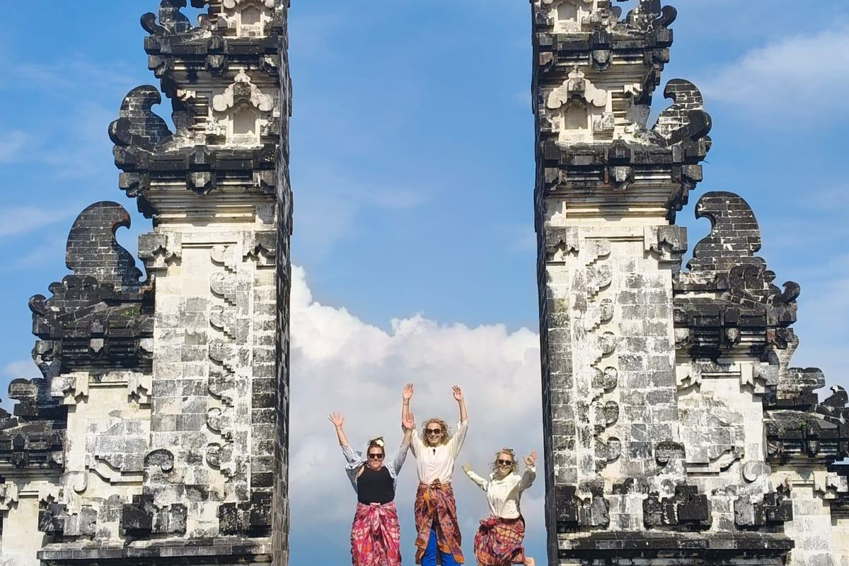 Visitors framed by the Gates of Heaven at Pura Lempuyang
